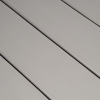 Close-up of grey composite dock decking boards installed side-by-side.